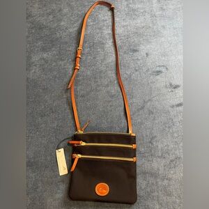 Dooney & Bourke Black Nylon Zip Pockets and Leather Strap.